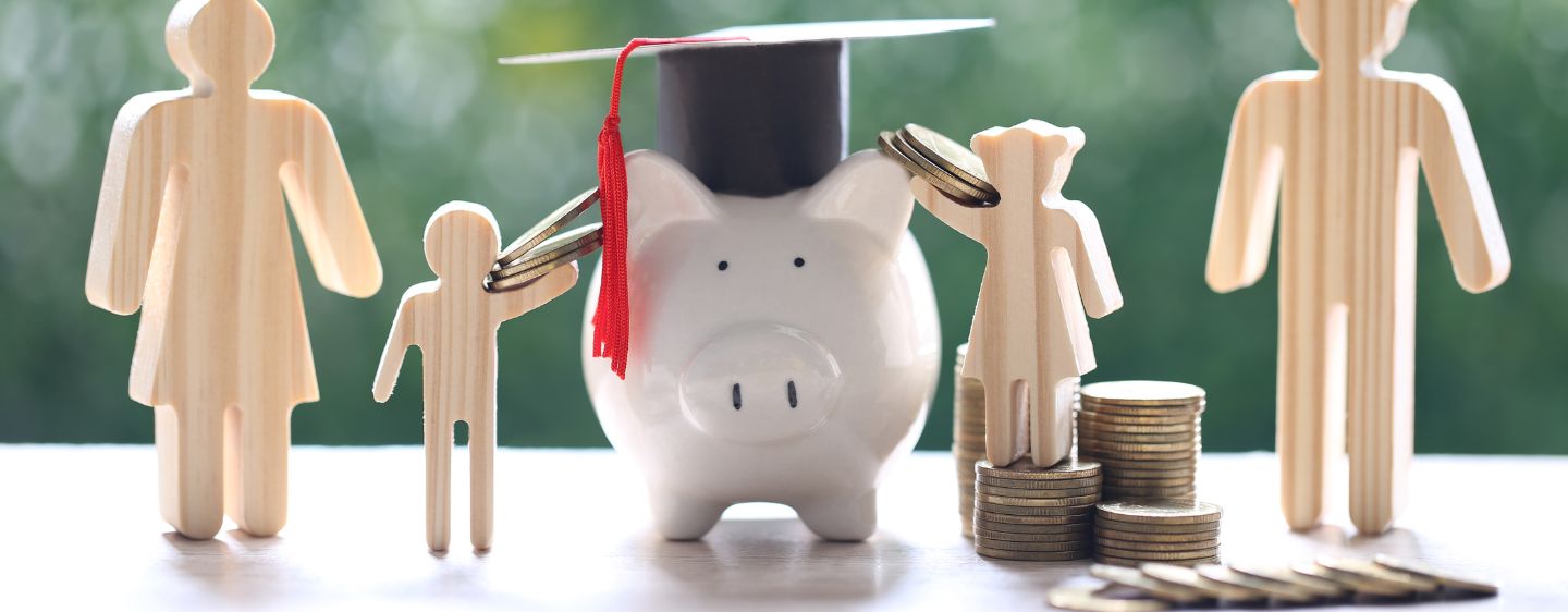 Coins, wooden people, piggy bank. 