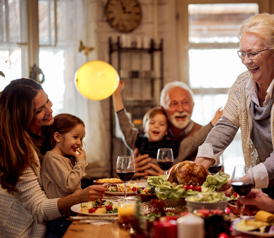 Family enjoys Thanksgiving dinner together.