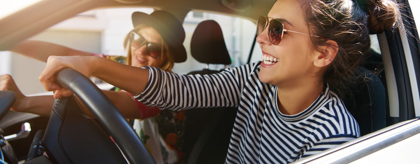 Girl driving car. 