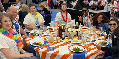 Image of CCU team members sitting around a table at a Best Places to Work event