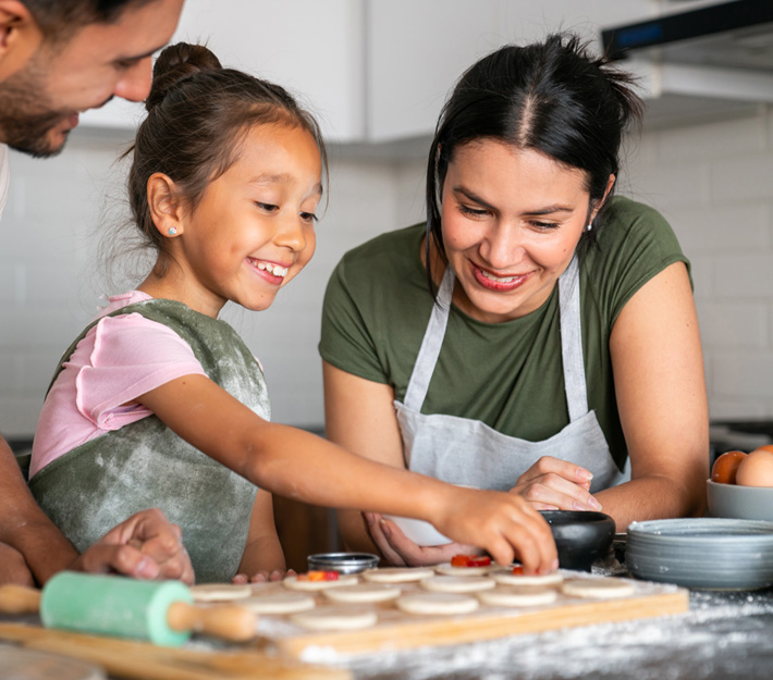 Family bakes cookies together