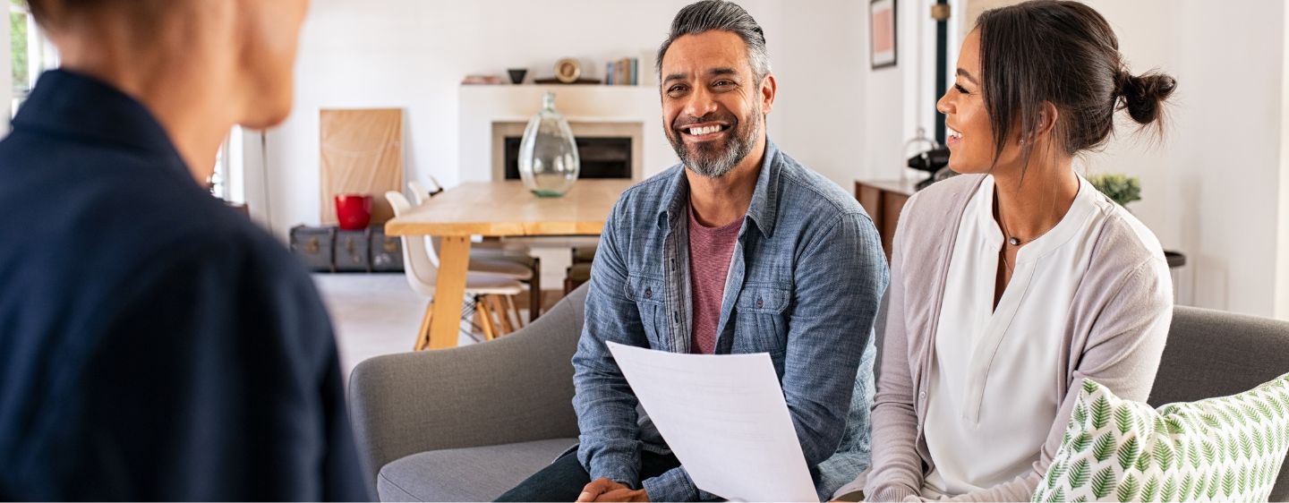 Man and woman smiling.