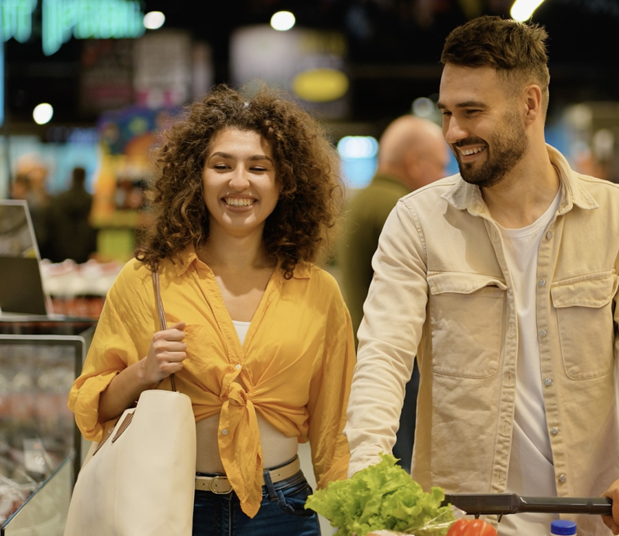 Man and woman grocery shopping.