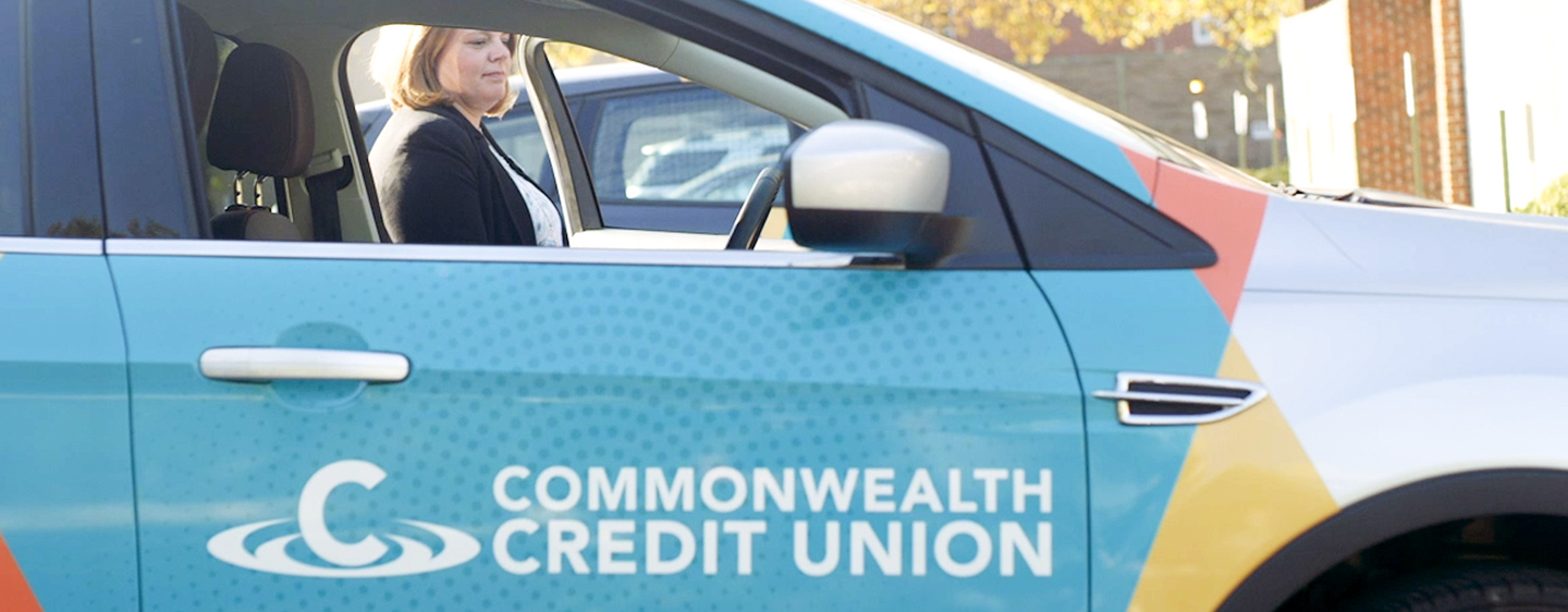 Commonwealth Credit Union employee getting in Commonwealth Credit Union car.